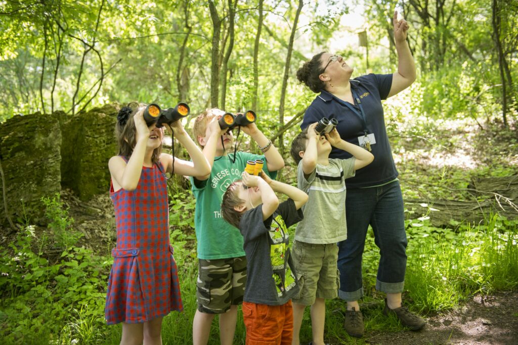 Kids looking through binoculars